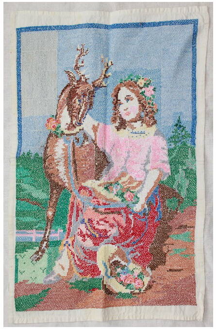 Вышивка
с изображением девушки и оленя.