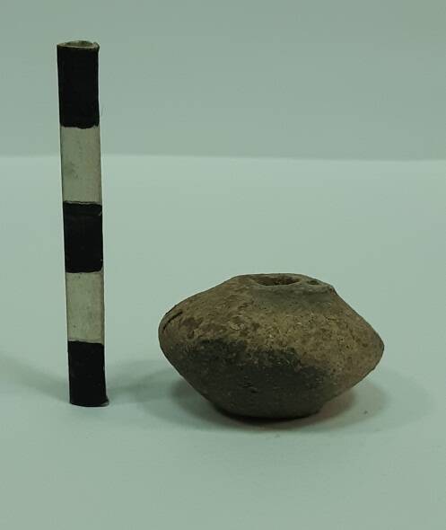 Пряслице глиняное биконической формы