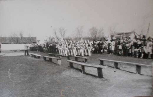 Фотопечать черно-белая. Парад на стадионе 1 мая. Маршируют учащиеся школы-интерната.