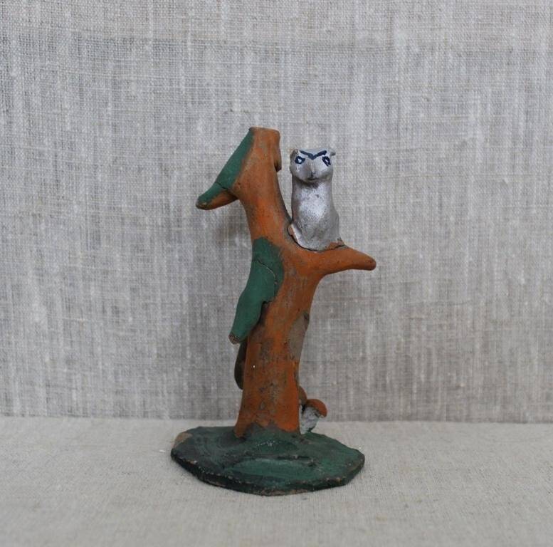 Каргопольская глиняная игрушка «Филин на дереве».