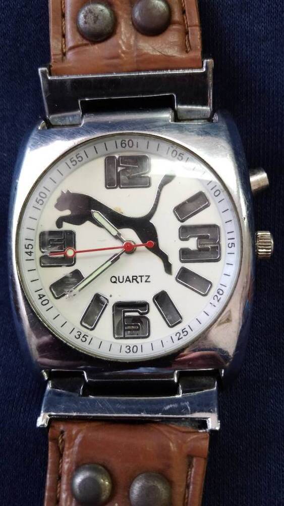 Часы мужские наручные кварцевые марки  QUARTZ  с рисунком пума на циферблате.