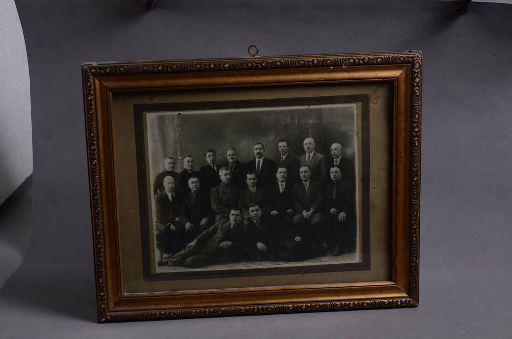 Фотография в раме.  Работники КВЖД  г. Харбин, 1930гг. Дудин М. Д. во 2 ряду 7 слева.