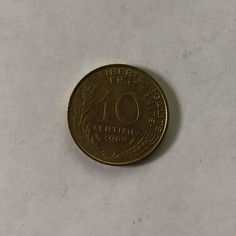 Монета номиналом 10  centimes 1988 года.